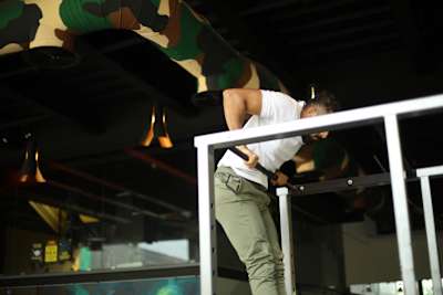 Kochi fitness trainer Nipun Viju performs calisthenics exercises in a gym.