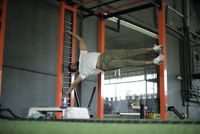 Kochi fitness trainer Nipun Viju performs calisthenics exercises in a gym.
