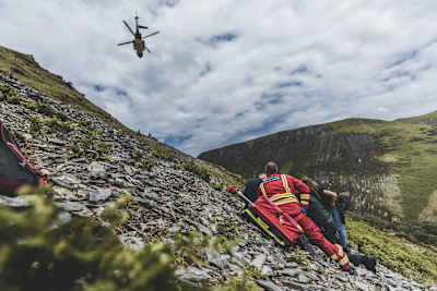 Gee Atherton helped by paramedics following his crash during filming of The Knife Edge in 2021