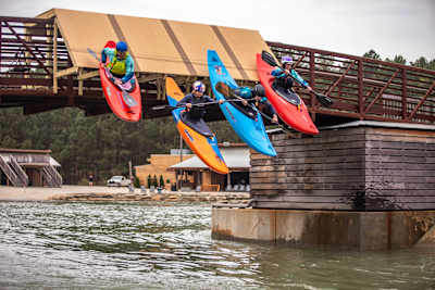 Evy Leibfarth in kayak freefall into the water from a bridge platform