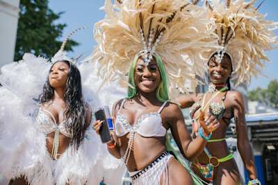 Dancers in flamboyant costumes at the Notting Hill Carnival in London, United Kingdom in August 2019.