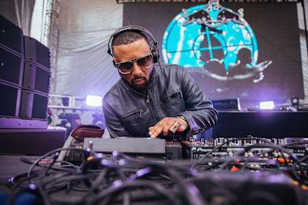 A photo of hip-hop producer and artist Madlib performing a DJ set at the 2019 Movement Festival.