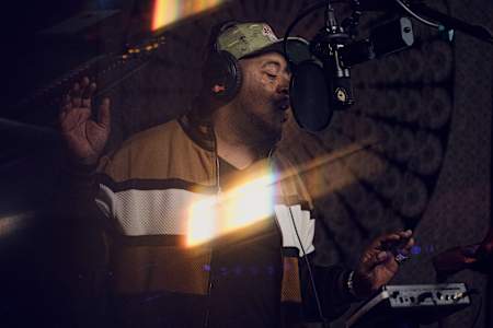 A photo of Twista rapping in the booth for Red Bull Studio Sessions: The Twista Edition.