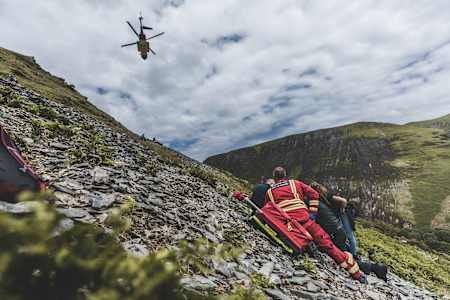 Gee Atherton helped by paramedics following his crash during filming of The Knife Edge in 2021