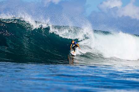 Molly Picklum rides the tube at the Hurley Pro Sunset Beach in Hawaii on February 19, 2023. 