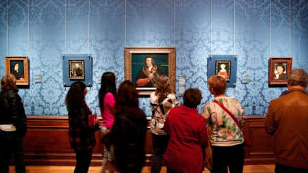 Portraits hang up in a museum in the Netherlands.