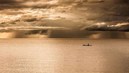 Kayaker on lake in Malawi, Africa.