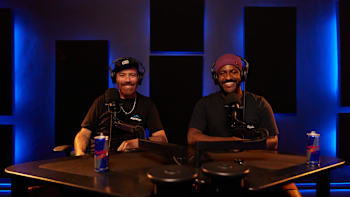 Hosts of Red Bull podcast Just Ride, Rob Warner and Eliot Jackson, sit at a mic desk.