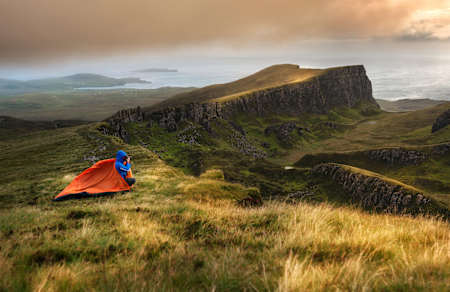 A wild camper perches high above the Quiraing circuit