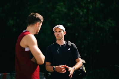 Dominic Thiem and Christoph Baumgartner share stories during an RB Leipzig training session in 2026.