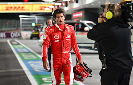 Carlos Sainz of Ferrari walks back to the Ferrari pits after hitting a drain cover at the Las Vegas F1 Grand Prix 
