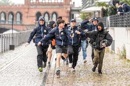 Team members run to the Red Bull Can You Make It? finish line in Berlin, Germany on May 28, 2024.