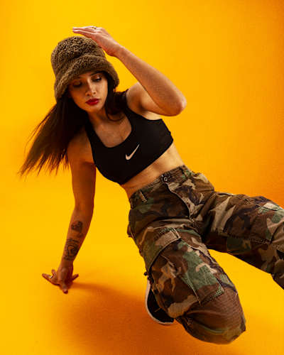 Carito showcases her footwork during a photoshoot.