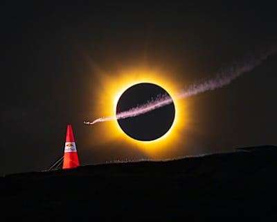 Mike Brewer flies beneath a total solar eclipse in Spain