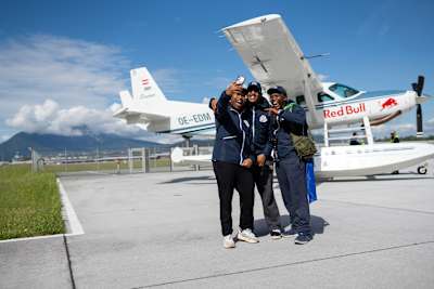 A team documents the moment for their vlog during a Red Bull Can You Make It? Checkpoint Challenge in Salzburg, Austria on May 23, 2024.