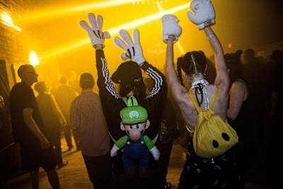 Ravers throw their hands up at Red Bull Music Academy Festival New York's Storm Rave in 2015.