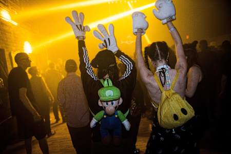 Ravers throw their hands up at Red Bull Music Academy Festival New York's Storm Rave in 2015.