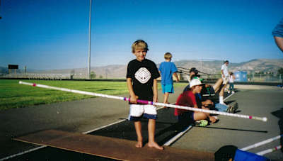 An image of a young Armand Duplantis holding a pole.