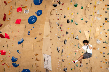 A team member takes on a climbing wall at a Checkpoint Challenge for Red Bull Can You Make It? in Vrbnje, Slovenia on May 24, 2024.