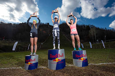 Winners Kameron Burmeister, Sarah Hendrickson and Kristen Monahan celebrate on the podium at Red Bull 400 at Copper Peak in Ironwood, MI, USA on May 11, 2019.