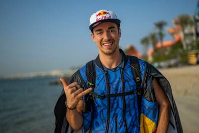 Wingsuit pilot Dani Román smiles while at the Ultimate Aerial Obstacle Course project by Red Bull