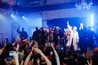 A photo of UK grime and dubstep artist and producer Swindle performing a live concert.