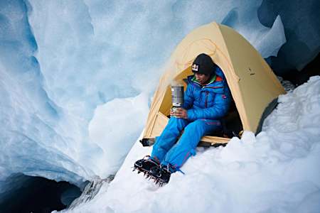 David Lama drinks tea during a break from climbing.