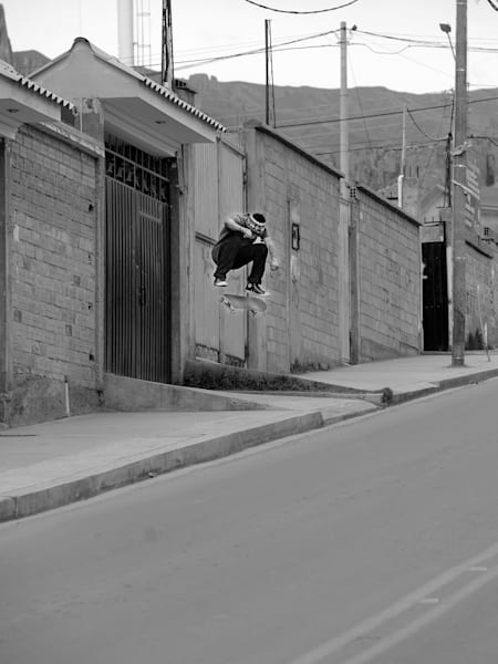Milton Martinez kickflips a road gap in La Paz.