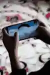 A gamer plays PUBG Mobile on a realme phone.