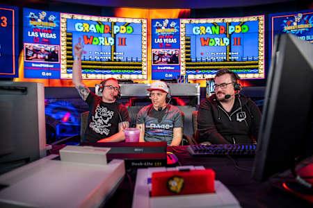 Me alongside NobleTOFU (left) and BarborousKing (right) at the second GrandPOOBear's Speedrun Session in Vegas.