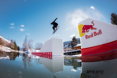 Pierre Vaultier jumps his snowboard over a spectacular pumptrack on a frozen lake in Serre Chevalier.