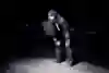 Man in running gear catches breath in the cold.
