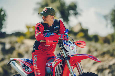 Jonny Walker poses with his new Beta bike, 2021