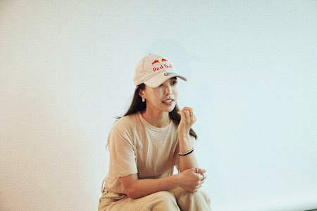 Sara Takanashi wears a Red Bull cap.