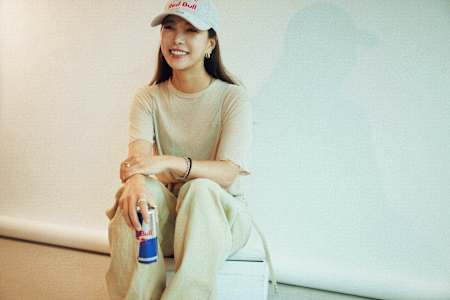Sara Takanashi poses with a Red Bull can.