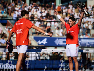 Arturo Coello raises his padel racket alongside Agustin Tapia during the 2026 Premier Padel Major Paris. 