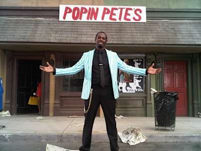 Dancer Popin' Pete photographed standing in front of a store named Popin Pete's.
