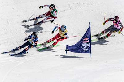 Sandra Naeslund, Fanny Smith, Katrin Ofner and Marielle Thompson compete during the finals of the Red Bull SuperSkicross in Andermatt, Switzerland on March 26, 2022. 