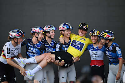 Overall race winner Demi Vollering (in the yellow jersey) celebrates winning the Tour de France de Femmes title alongside her Team FDJ UNITED-SUEZ teammates in Nice, France. 