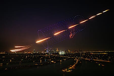 Drones create a gigantic Red Bull can in the Dubai night skies at the Red Bull Ultimate Aerial Obstacle Course challenge 