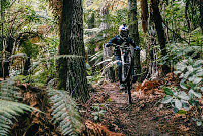 Brook MacDonald does a wheelie in Whakarewarewa Forest in Rotorua, New Zealand, on April 1, 2021.