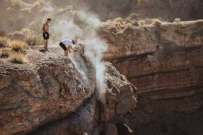 Gee Atherton's dig team working on a drop at Red Bull Rampage 2023
