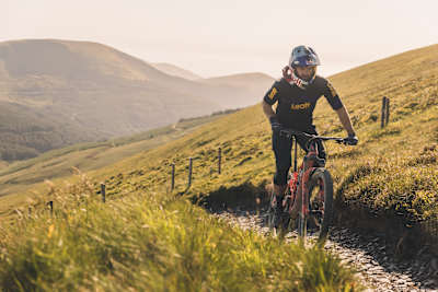 Greg Callaghan rides at the 2023 Red Bull Mountain Bike Performance Camp at Dyfi Bike Park, Wales.