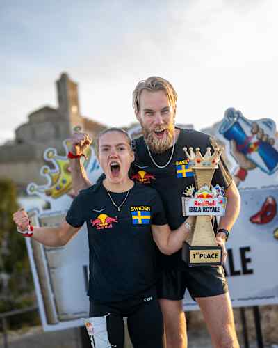 Linnea Stenson and Daniel Ekström, winners of the first-ever Red Bull Ibiza Royale obstacle race, celebrate with their trophy in Ibiza, Spain on April 9, 2025.