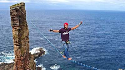 Schulz pictured high above the coast with Old Man of Hoy in the background