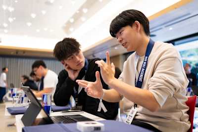 Rintaro Oda and Changhyun Moon of team MIGAKO at work ahead of presenting their idea during the Red Bull Basement World Final in Tokyo, Japan on December 3, 2024.