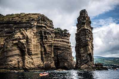 Kayakers watch the third stop at the Red Bull Cliff Diving World Series in Azores, Portugal on July 14, 2018.