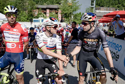 World Champion Remco Evenepoel and Wout van Aert greet each other at the race start of stage 5 of the 86th Tour de Suisse 2023 on June 15, 2023. 