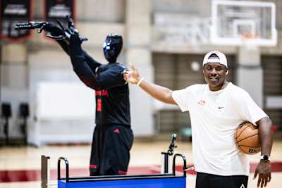 Chris Matthews, aka Lethal Shooter, shooting hoops with Cue6, the world’s most advanced basketball robot.