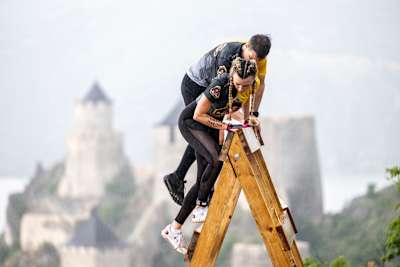Competitors perform during the Red Bull Fortmaster OCR race in Golubac, Serbia on May 28, 2022.   
